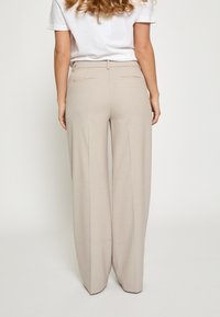 Minus ELVERA MID WAIST  - Hlače - string grey