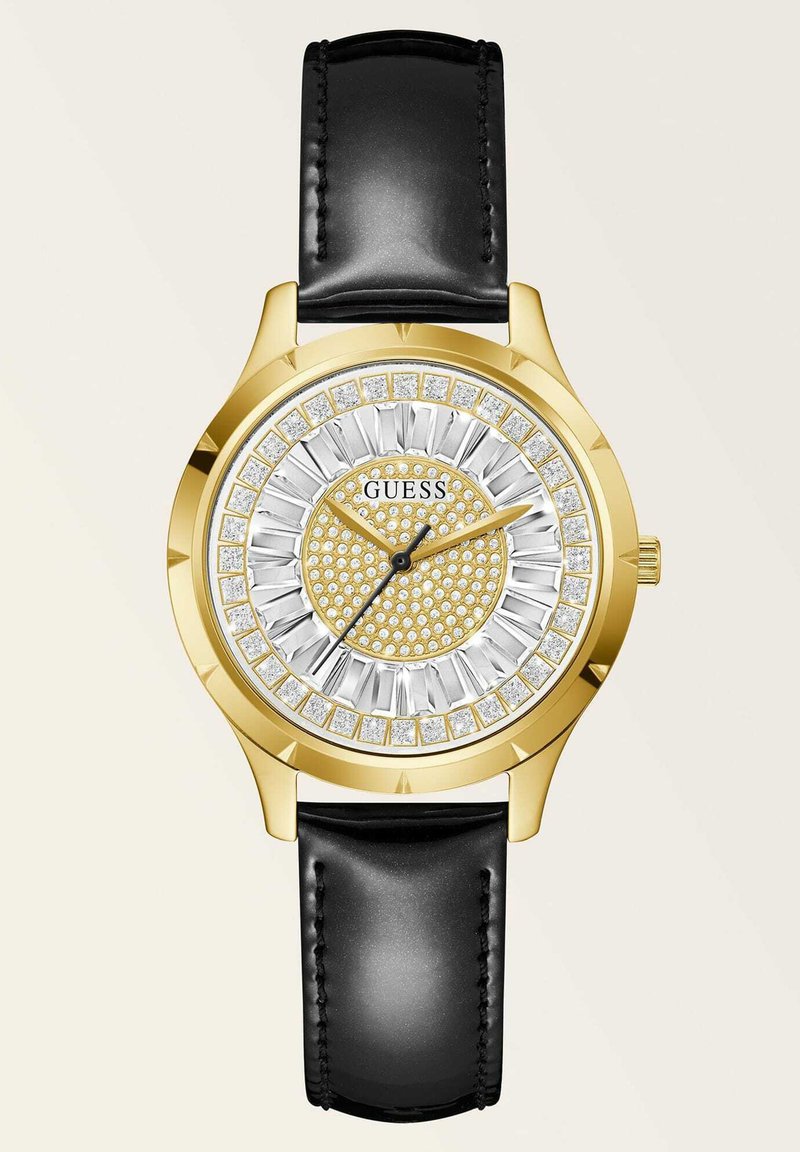 Goldfarbene Uhr mit einem silbernen und goldenen Zifferblatt, das ein strukturiertes Muster und Kristallakzente aufweist; schwarzes Lederarmband.