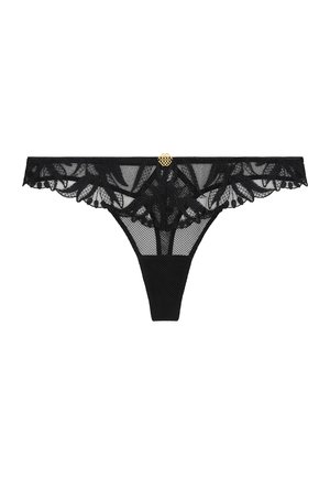 Tanga en dentelle noire avec broderie florale et un petit charm doré décoratif au centre de la taille sur fond blanc.
