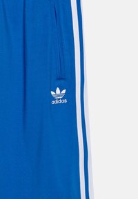adidas Originals FIREBIRD UNISEX - Träningsbyxor - blue
