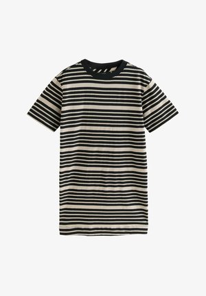Robe t-shirt rayée en crème et noir. Manches courtes, col rond et tissu doux avec des lignes horizontales de largeurs variées.