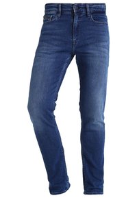 Slim-fit blue denim jeans with slight fading on thighs, five pockets, front button, and zipper closure.