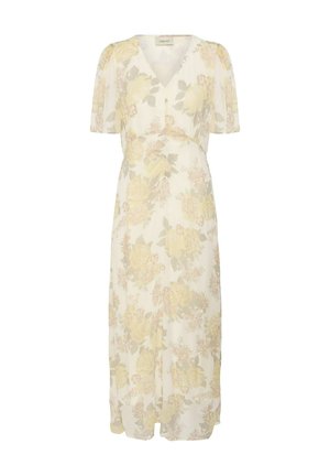 Robe longue couleur crème avec manches courtes, col en V et motif floral jaune sur tout le tissu.