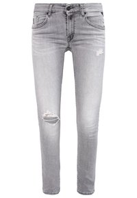 Jeans ajustados grises de denim, con desgastes en las rodillas, un diseño clásico de cinco bolsillos y un cierre estándar de botón y cremallera.