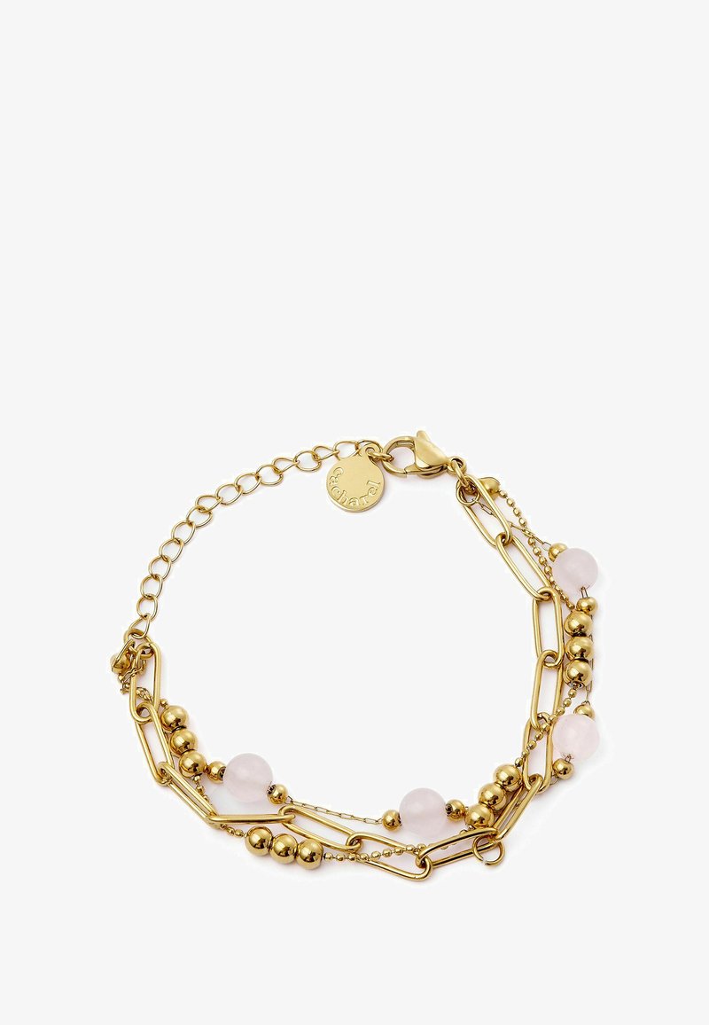 Auksinė grandinėlė, kurioje yra sujungtos grandinės, apvalūs auksiniai karoliukai ir rožiniai stiklai. Uždarymas apima mažą etiketę.