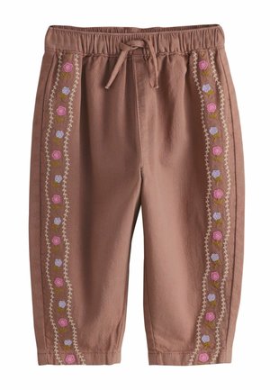 Pruunid väikelaste püksid elastse vöökohaga, nööriga ja vertikaalsete lillidega tikitud triipudega roosa, lilla ja rohelise värvitoonis säärtel.