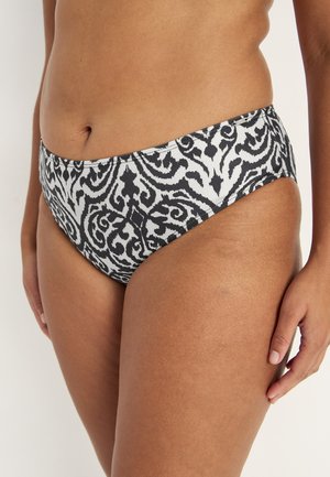 Bikini ala danamask hitam-putih, desain tinggi sedang, kain halus, dan cakupan yang moderat.