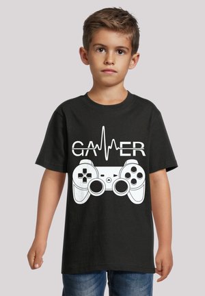 Schwarzes Baumwoll-T-Shirt mit einem weißen Controller-Design und dem Text "GAMER" sowie einer Herzschlaglinie, mit kurzen Ärmeln und Rundhalsausschnitt.