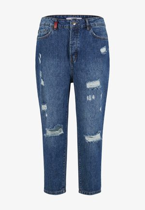 Blue denim jeans with distressed areas, including large rips and frayed edges. Features a classic five-pocket design and a button closure.
