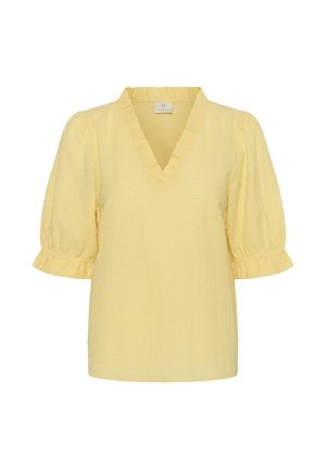 Bluză texturată de culoare galben deschis, cu guler în V cu volănașe și mâneci scurte bufante care se termină în manșete cu volănașe.