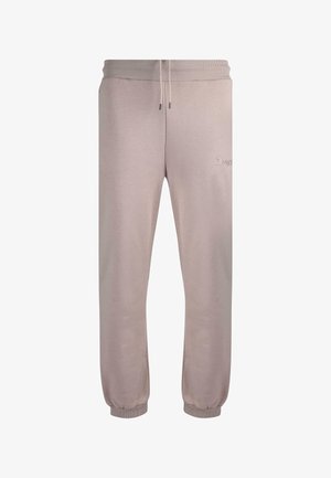Light beige jogger pants made of soft fabric, featuring an elastic waistband and cuffs, with subtle embroidered logo on the front.