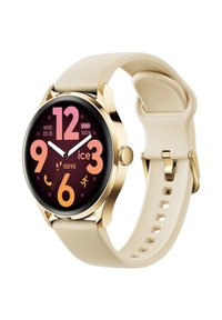 Orologio color oro con quadrante circolare, numeri rosa su uno sfondo scuro e cinturino in silicone beige con chiusura a perno e piegatura.