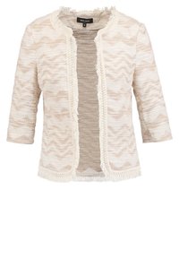 Veste légère blanc cassé avec un motif en zigzag texturé, bords effilochés, et manches trois-quarts. Design à l'avant ouvert sans fermetures.