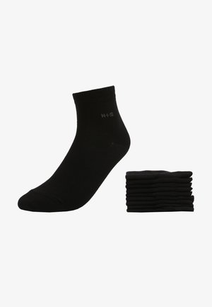 Schwarze Knöchelsocken, aus Baumwollmischung, mit elastischen Bündchen. Acht Paar ordentlich gestapelt, mit einem dezenten Logo auf einer Socke. Weiche Textur.