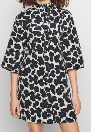 Dress with black and dark blue floral pattern on white, featuring puffed three-quarter sleeves and a high neckline.