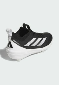 Black athletic shoe with white stripes, textured upper, and a sleek design. Light sole with studs for traction. Features a pull tab at the heel.