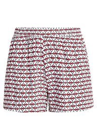 Pantaloni bianchi con un motivo ripetuto di forme geometriche rosse e nere. Presentano una vita elastica e un tessuto leggero.