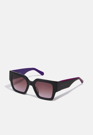 Black rectangular sunglasses with gradient lenses, purple arms, and sleek edges. Features a matte finish and subtle logo on the temple.