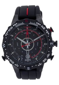 Black Timex wristwatch with compass bezel, red and white hands, tide and temperature indicators, and a black rubber strap with a red stripe.