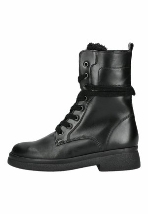 Schwarzer Lederknöchel-Stiefel mit Schnürung vorne, flauschigem Innenfutter und robuster, strukturierter Sohle, seitlich dargestellt.