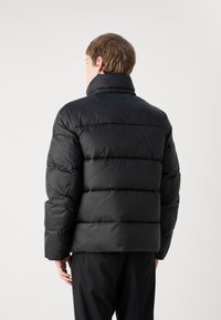 Calvin Klein HOODED QUILT PUFFER - Zimska jakna - black