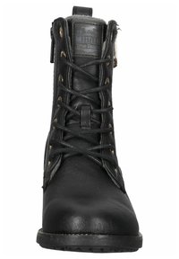 Stivale alla caviglia in pelle nera con punta rotonda, design con lacci, occhielli color oro e rivestimento in pelliccia sintetica nella parte superiore. Suola testurizzata.