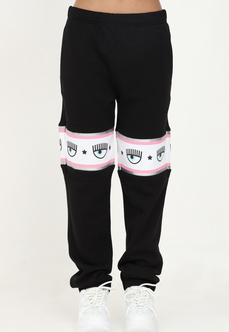 Svarta sweatpants med vitt och rosa ögondiagramdetalj vid underbenet, med ett bekvämt elastiskt midjeband och mjukt tyg.