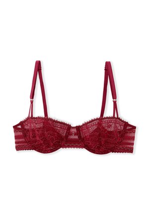Reggiseno in pizzo borgogna con ferretto, motivo floreale trasparente, spalline regolabili e una rifinitura decorativa lungo il bordo superiore e la fascia.