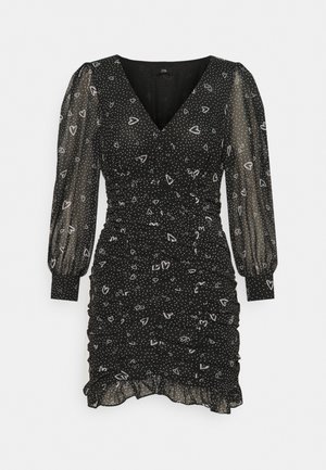 Schwarzes Kleid mit V-Ausschnitt, durchsichtigen Puffärmeln, gerafftem Textur, weißen Punkten und Herzmustern, mit einem ausgestellten Saum.