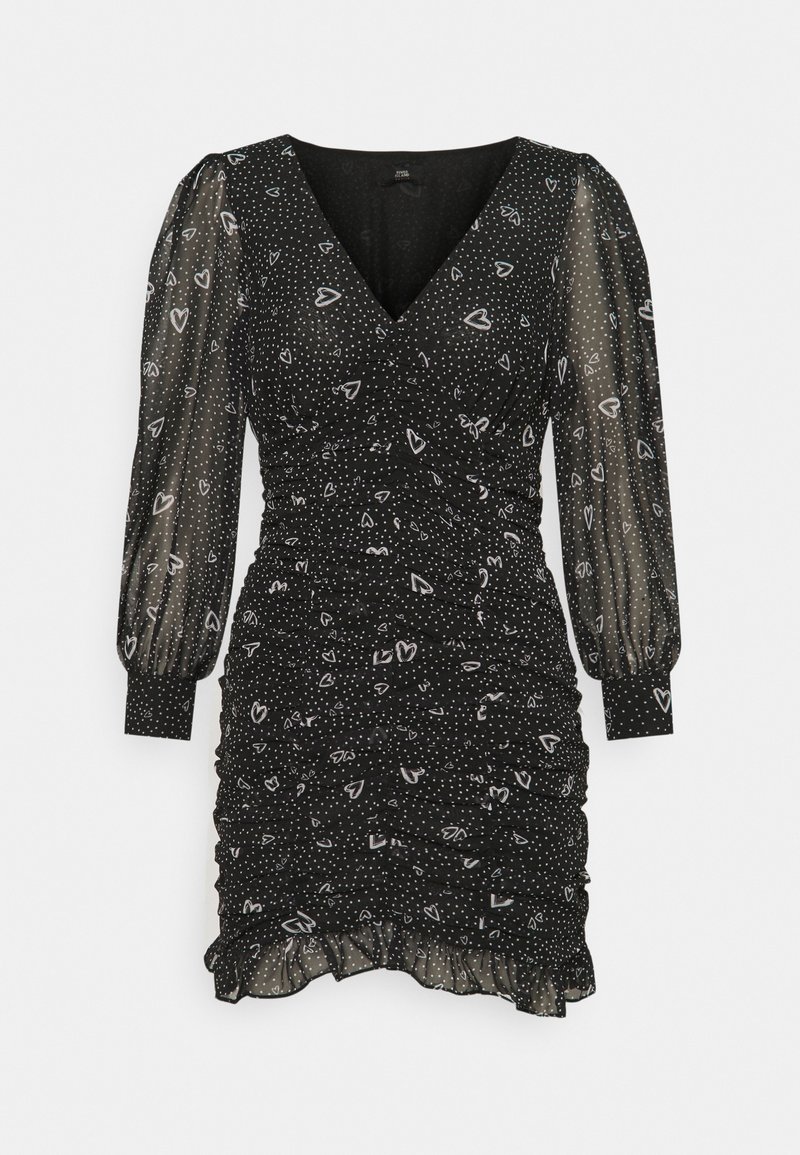 Black dress with a V-neck, sheer puff sleeves, ruched texture, white polka dots, and heart patterns, featuring a flared hemline.