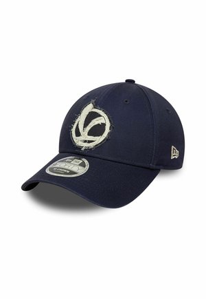 Navy blue baseball cap with frayed circular logo on front and New Era brand symbol on side, angled to show curved brim.