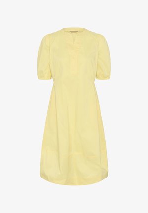 Kollane põlveni ulatuv kleit, millel on puff-varrukatega lühikesed varrukad, V-kujuline kaeluslõige ja ees ühe nupuga plastron.