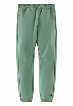 Zielone zwężane spodnie dresowe z elastycznym pasem i ściągaczami, bocznymi kieszeniami na suwak oraz małą czarną naszywką z logo w pobliżu lewego kostki.