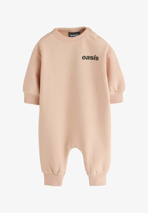 Bėgio ilgu rankovėliu kūdikio kombinezonas, smėlio spalvos, su ribuotu rankogaliu ir ant krūtinės juodomis raidėmis užrašytas žodis „oazė“, su spaudėlėmis ant peties.