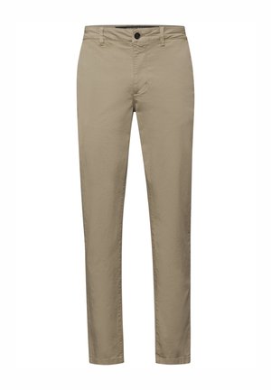 Pantalon beige en coton avec une texture lisse, équipé d'une fermeture à boutons, de poches classiques et d'une coupe fuselée.