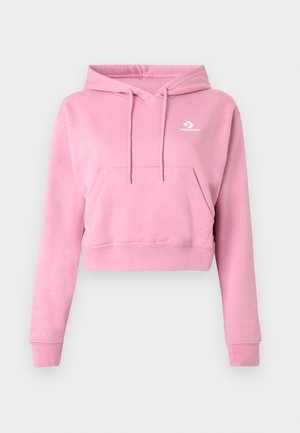 Ružová skrátená mikina s kapucňou, predným vreckom, sťahovacími šnúrkami, dlhými rukávmi a malým bielym logom Converse na hrudi.