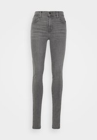 Jeans ajustados en denim gris, con una cintura alta, cinco bolsillos y un ligero efecto de desgaste. La tela tiene una textura suave y un estiramiento mínimo.