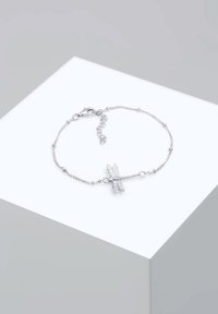 Silversmycke med en libelldesign, en fin kedja med små pärlor och en krabba för låsning.