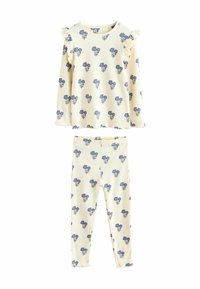 Ensemble de pyjama rayé comprenant un haut à manches longues avec des épaules froncées et un pantalon assorti, tous deux ornés de motifs floraux bleus sur un fond crème.