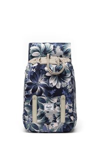 Kwiatowy plecak o ciemnoniebieskiej bazie, z dużymi białymi i turkusowymi kwiatami, z zasuwanym zamknięciem oraz beżowymi akcentami na dole.