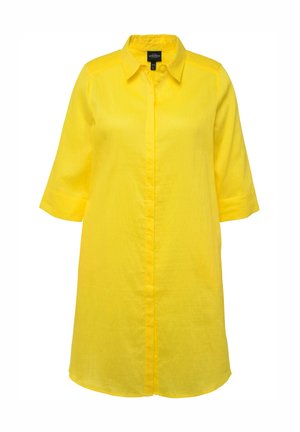Gul linned skjortekjole med krave, knapp-down foran og trekvartærligærmer. Har en afslappet pasform og glat tekstur.