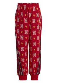 Pantalones de chándal rojos con un estampado de letras 'M' blancas y cabezas de Mickey Mouse amarillas por toda la prenda. Presenta franjas laterales negras y una cintura elástica.