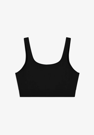 Reggiseno sportivo nero senza cuciture con spalline larghe e scollo tondo, posato su uno sfondo bianco.