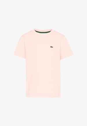 T-shirt rose clair à manches courtes et col rond avec petit logo crocodile vert sur la poitrine gauche.
