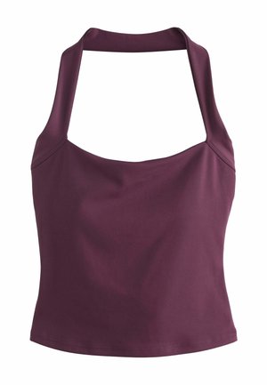 Ujjatlan, sötétlila halter nyakú felső, négyzet alakú nyakkivágással és testhezálló derékkal.