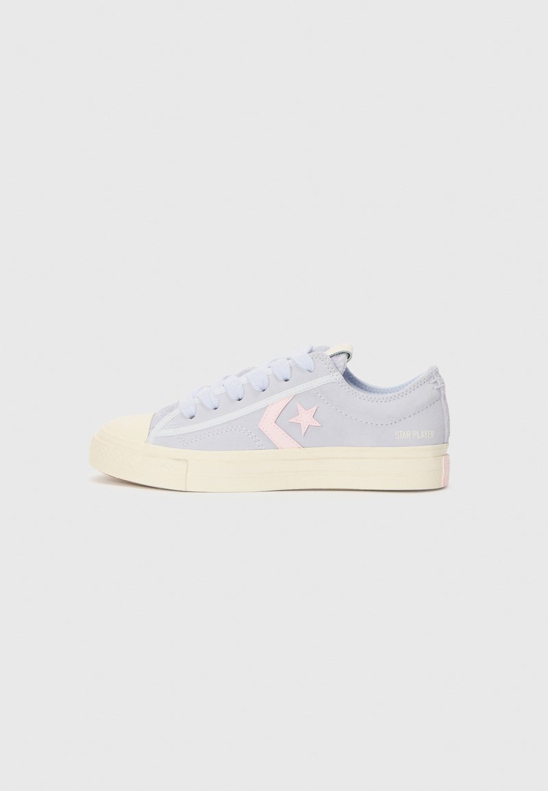 Light blue canvas sneaker with a cream rubber toe cap and sole, featuring a pink star design and 'STAR PLAYER' text in pastel on the heel.