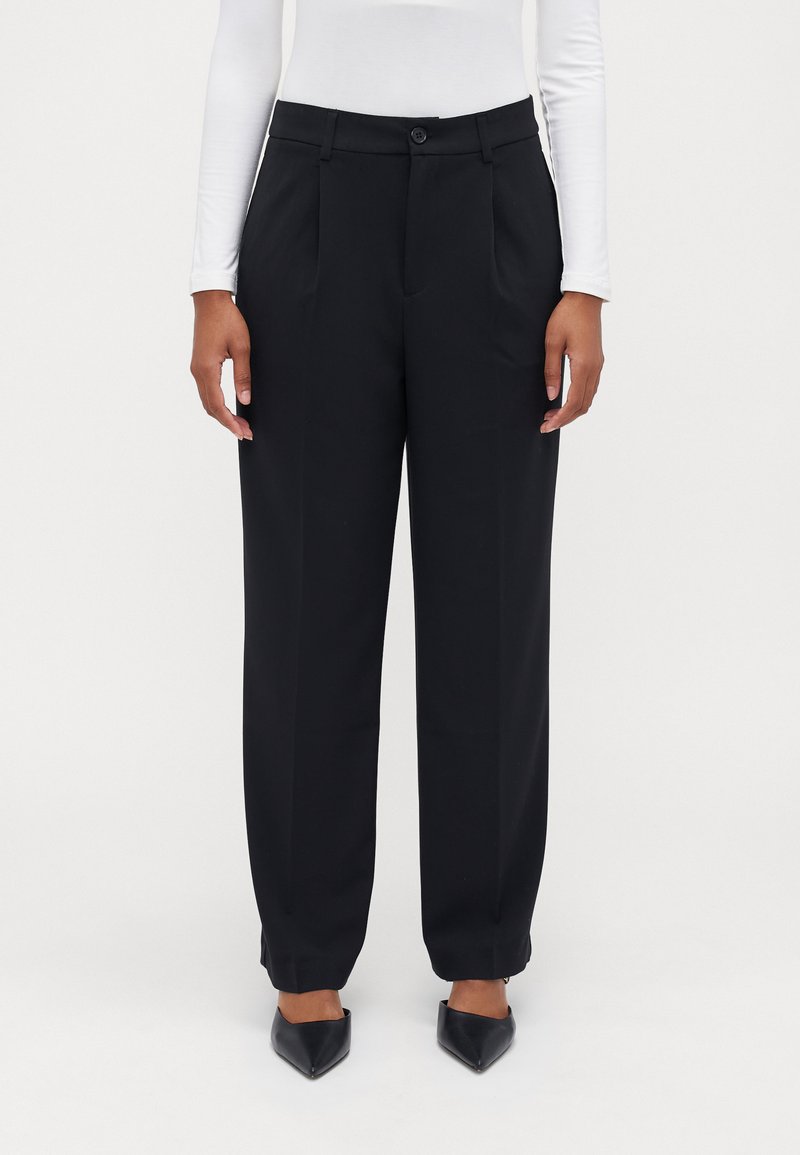 Black tailored trousers with a high waist, pleats, and side pockets. Made of smooth fabric, with a button closure and cuffed hems.