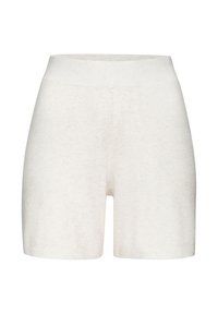 Knit beige shorts with a high waistband, featuring a ribbed texture and a form-fitting design. Hem finishes are clean with no additional accents.