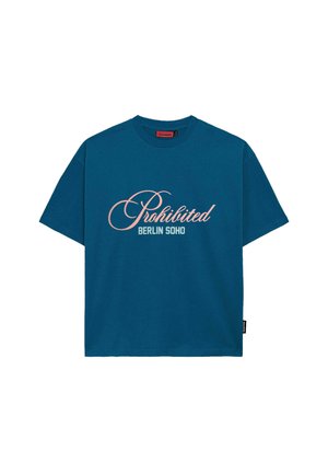 Teal cotton t-shirt featuring "Prohibited" in cursive pink text and "BERLIN SOHO" in block letters, with a round neckline and short sleeves.