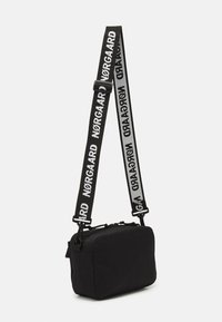 Mads Nørgaard TIAN FAE BAG UNISEX - Mala a tiracolo - black